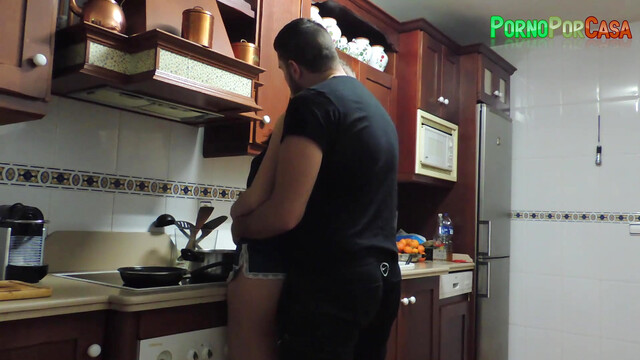 Sex between the kitchen stoves with the busty brunette